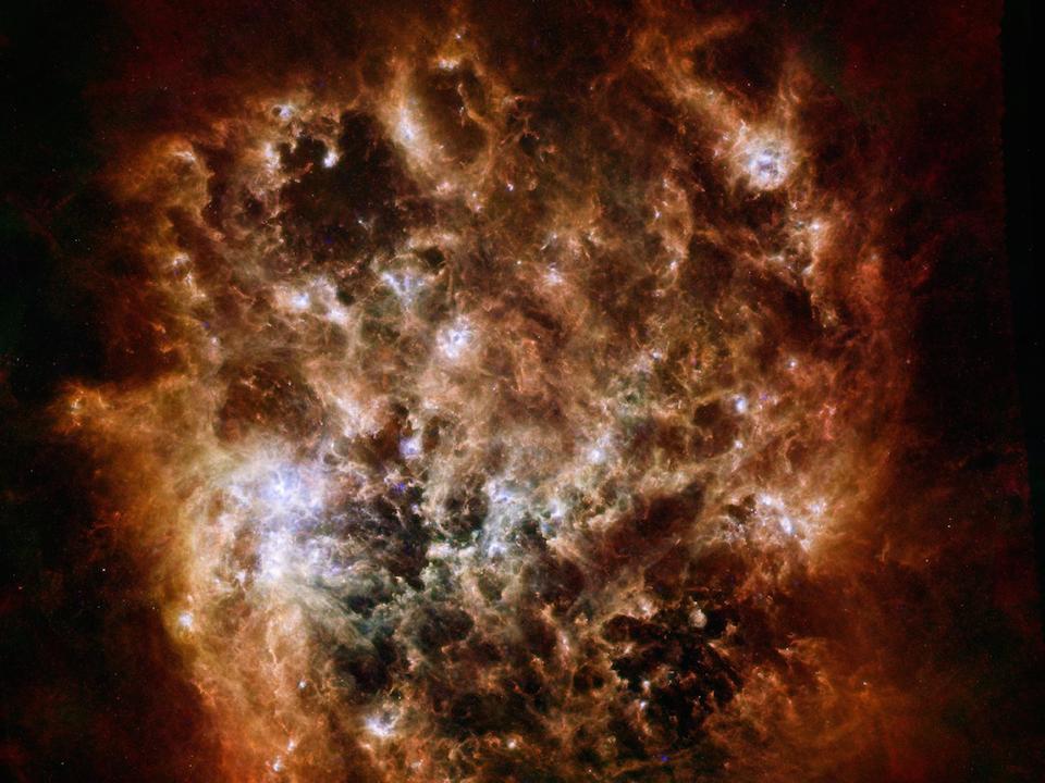 El tumultuoso corazón de la Gran Nube de Magallanes- ESA/NASA/JPL-Caltech/STScI